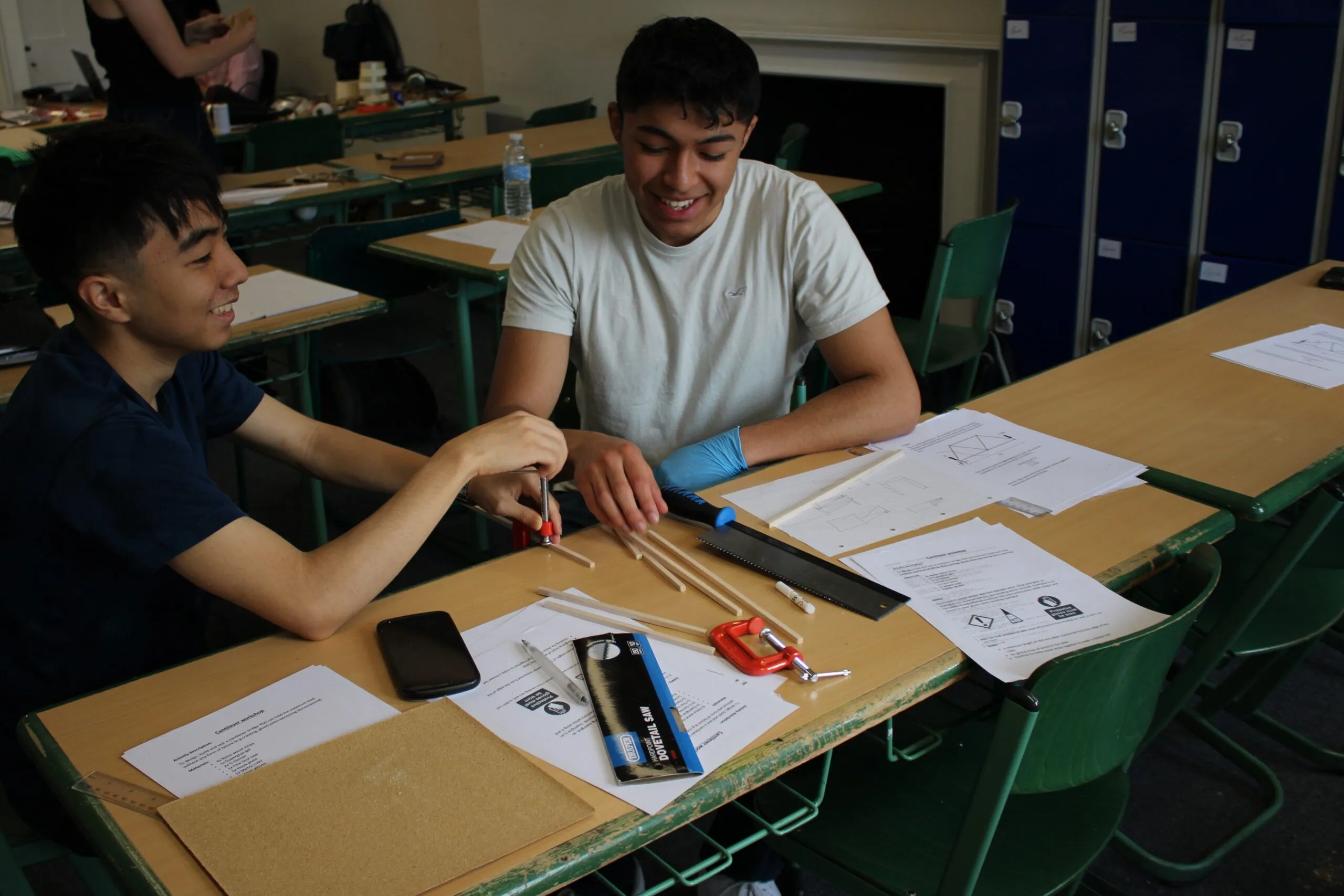 Happy students celebrating in library